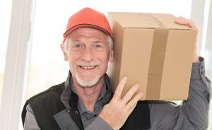 Portrait of smiling senior deliverer